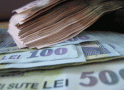 Românii cu venituri mici vor primi 1.400 de lei pentru plata facturilor la energie şi vouchere sociale
